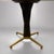 This elegant dining table features an hourglass shaped base of black hardwood with brass inlay. The top is a reverse...