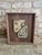 Pair of abstract speckled ceramics with raised features mounted in a custom raw walnut frame. The artist of these vintage...