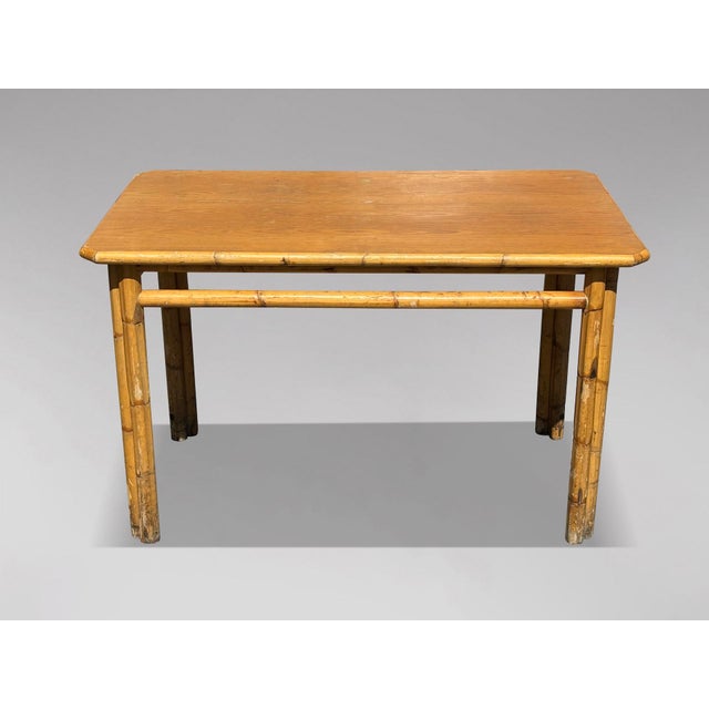 This mid-20th-century French Riviera bamboo dining table features a rectangular bamboo frame. The table showcases a lovely...