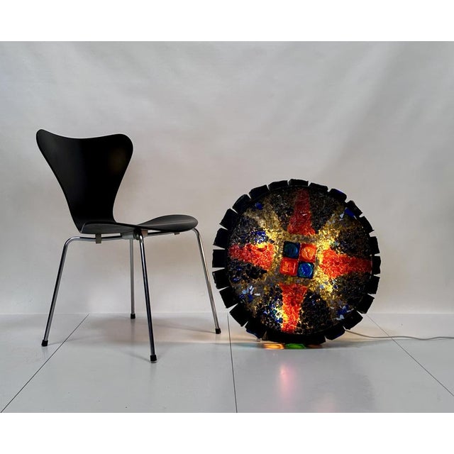 This impressive lighting object is a illuminated piece of glass art, created by the famous Swedish artist and designer...