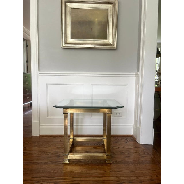 Beautiful 1970's glass and brass square coffee table by Mastercraft. Brass square profile with thick 3/4 inch chamfered...