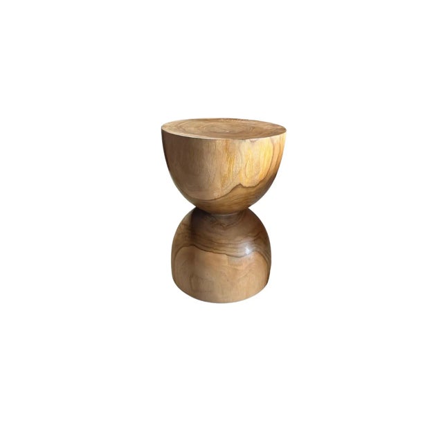 A wonderfully sculptural side table crafted from Teak Wood. Its curved edges add to its charm. This table features a...