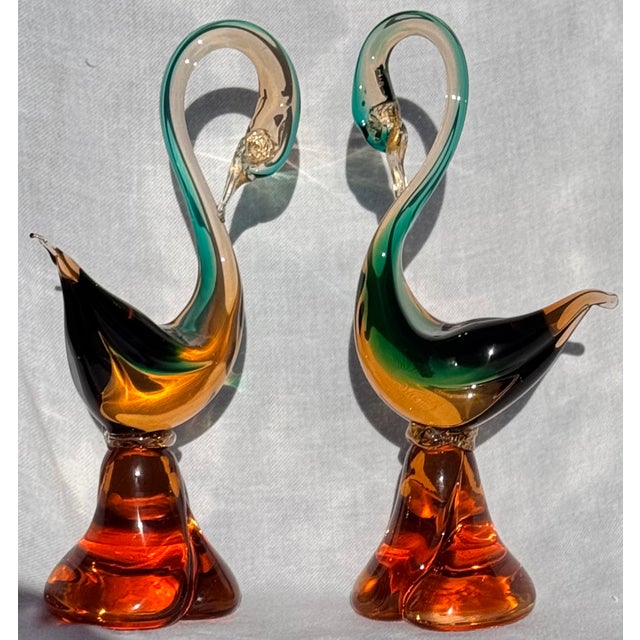 Presenting a pair of fine blown Murano glass swans. Pontils present of the underside, glass colors of aqua turquoise...