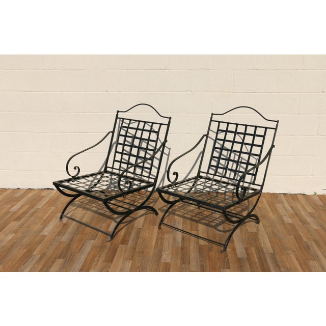 Exceptional vintage pair of wrought iron outdoor folding armchairs attributed to Hervé Baume, France, 1970s. These...