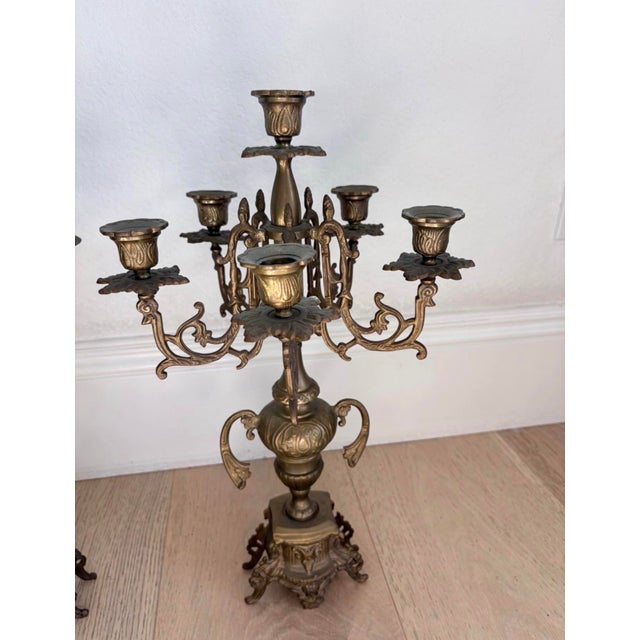Striking coordinating pair of substantial vintage six-light candelabra in an elaborate Rococo Revival style. The two...