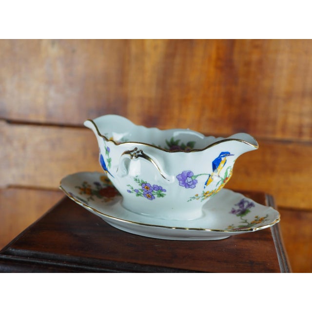 Saucer with kingfisher and flower decoration. The baroque charm of this sauce boat is suitable for rustic, country,...