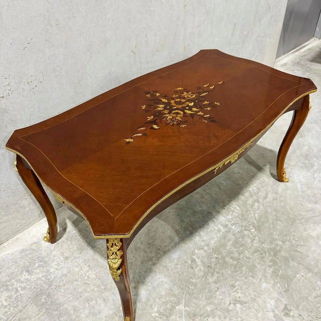 Transform your home with the elegance it deserves. Beautiful copper coffee table with gold leaf details. The coffee table...