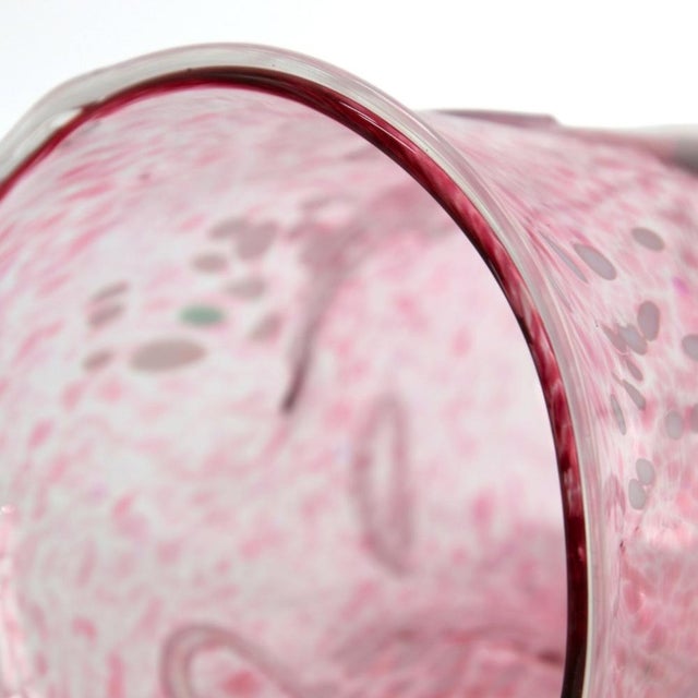 The Dolce Vita Vase is handcrafted using traditional Murano glassblowing techniques, blending soft baby pink and opaque...