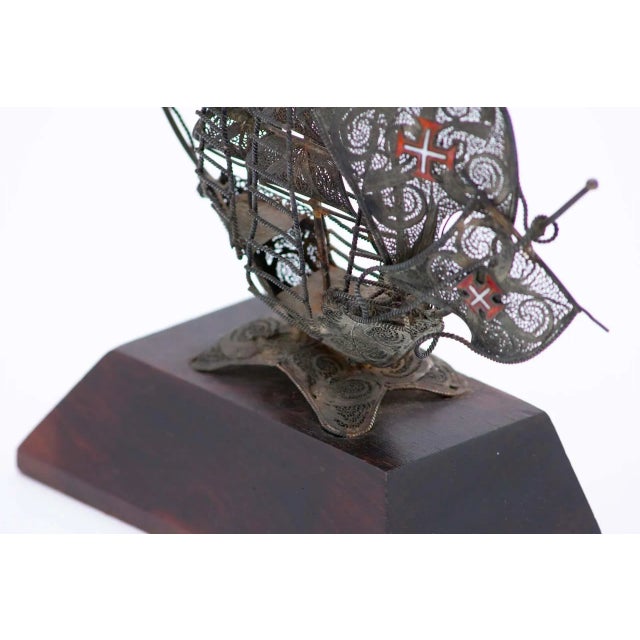Silver Filigree Caravel with Wooden Base, in Very Good conditions. Designed 1920 to 1949 This piece has an attribution...