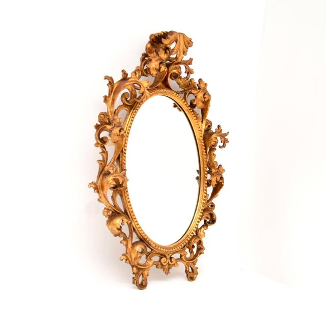A fabulous antique Italian Rococo style gilt wood mirror. This dates from around the 1930’s period and it is of extremely...