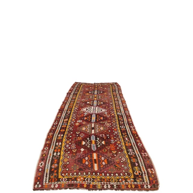 Vintage handwoven decorative kilim rug from Kars region of Turkey. Approximately 50-60 years old. In very good condition.