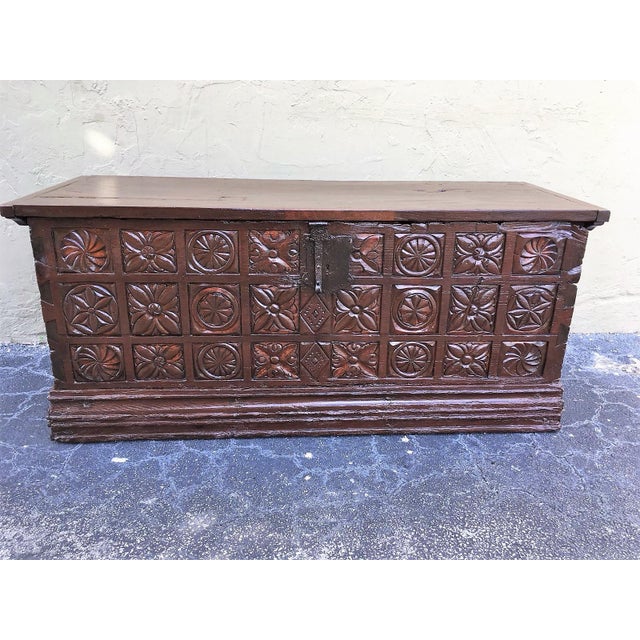 Nice 17th century chest in brown chesnut. Hand carved facade panel with geometrics decorations. Plinth with brace...