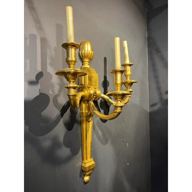 A pair of circa 1940’s gilt bronze sconces with 3 lights very unusual large size