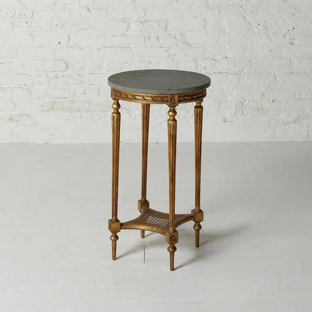 This elegant 1950s Louis XVI Marble & Oak Side Table embodies timeless French sophistication with its refined proportions...