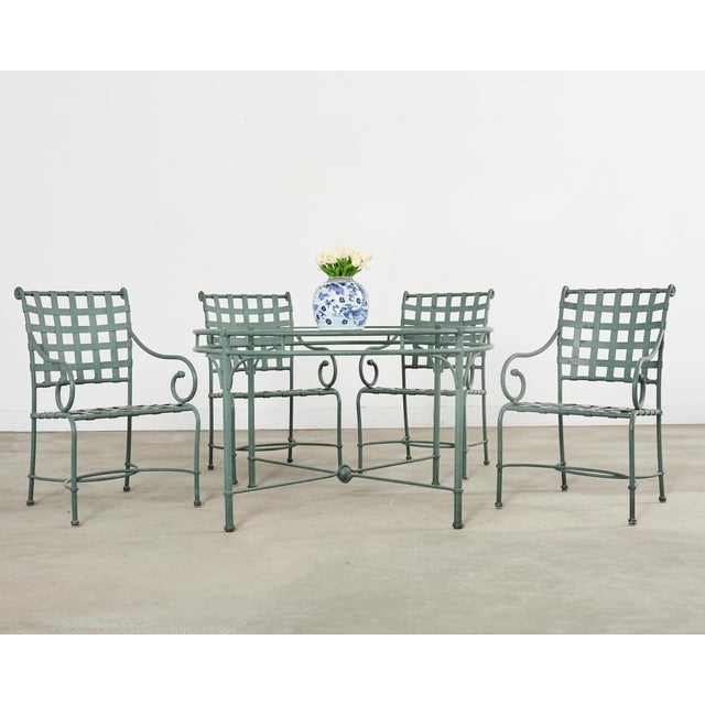 Exceptional signed set of Brown Jordan Florentine garden dining chairs and table designed by Richard Frinier. The set...