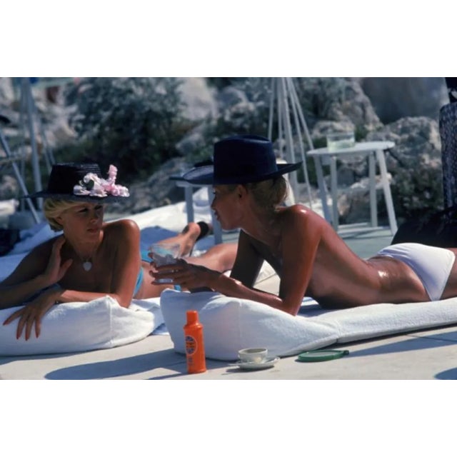 Slim Aarons, Sunbathing in Antibes, Estate Stamped Photographic Print, 1976 / 2020s For Sale