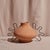The Ines Terracotta Vessel by Diego Olivero Studio for Meso Goods is a striking sculptural accent handcrafted by artisans...