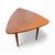 An authentic Jens Risom teak side table in the highly collectible “guitar pick” triangular form, a true Mid-Century Modern...