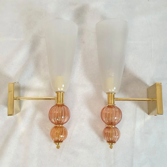Pair of large Murano glass wall sconces, attributed to Venini Italy 1970s. The Mid Century Modern sconces have brass...