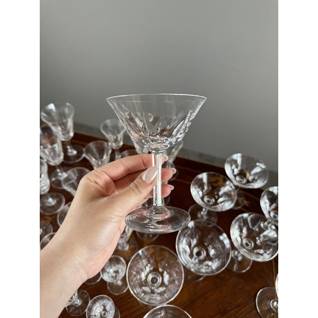 Elegant crystal glassware set from Saint Louis, Cerdagne pattern, renowned for its exceptional craftsmanship and crystal...