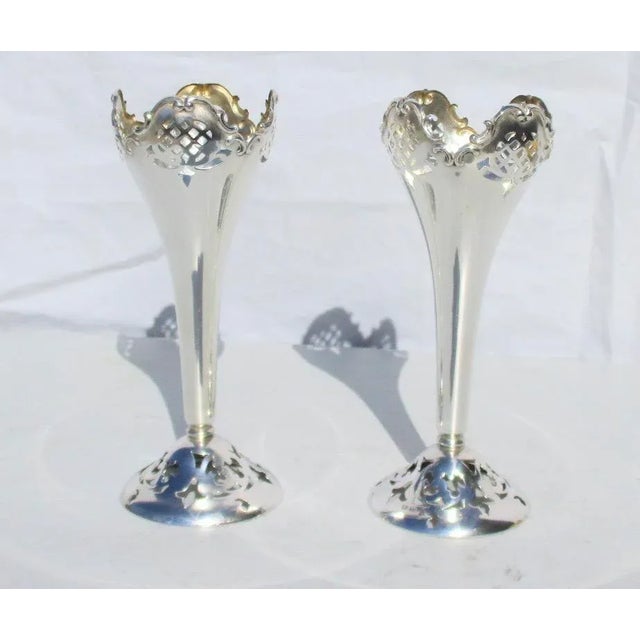 Silver vases with pierced work decorations from the early 20th century. Hallmarked to the foot Small floral vase for a...