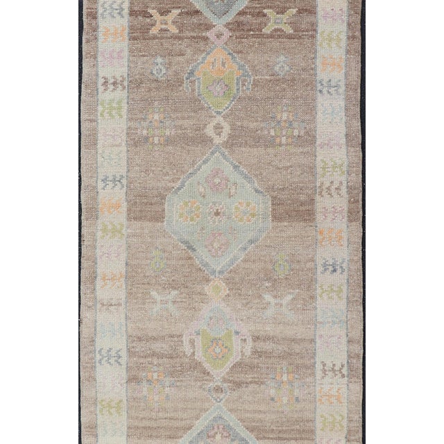 Turkish Oushak Runner With Soft Brown Field and Pale Blue Geometric Medallions For Sale In Atlanta - Image 6 of 12