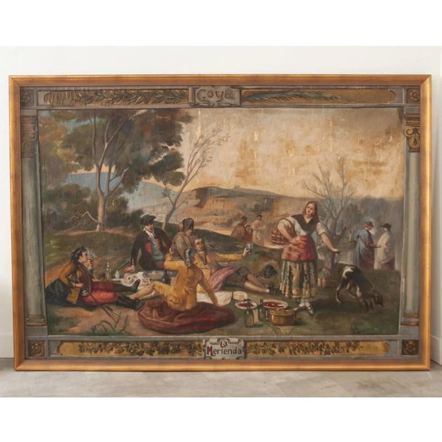 The title, “La Merienda” written at the bottom of this cartoon, refers to a light meal served between lunch and dinner. At...