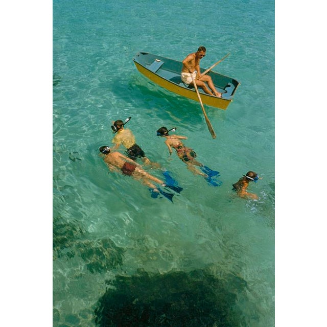 Snorkelling In Bermuda by Toni Frissell A group of children go snorkelling along side a boat, Bermuda, 1956. (Photo by...