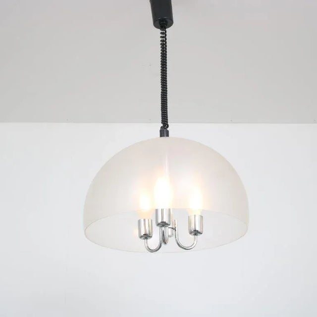 A beautiful hanging lamp manufactured by Glashütte Limburg in Germany around 1970. This wonderful piece is made of high...