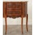 This striking little demilune commode features exceptional inlaid mahogany in a variety of grain patterns that have been...