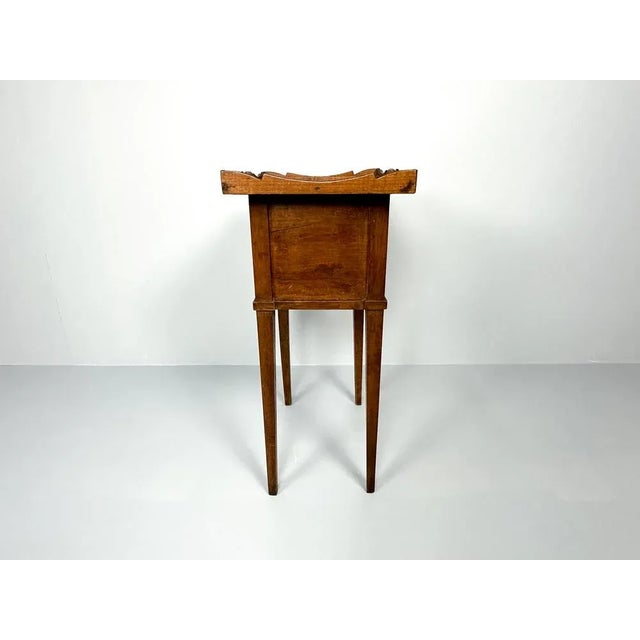 Beautiful antique bedside cabinet with roller door. The top features a small, original raised edge. Perfect as a...