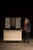 Striking hybrid display piece combining a low, painted storage cabinet with an integrated decorative screen above. The...