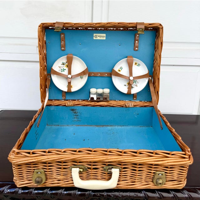 This charming vintage Sirram picnic hamper, circa 1960s, was made in England and features a beautifully woven wicker...