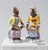 A charming pair of Chelsea House porcelain Monkey Band singer figurines inspired by the celebrated Meissen Affenkapelle...