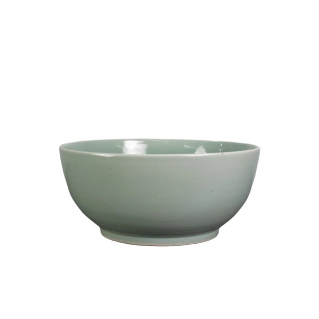 This large celadon bowl is handmade and each has its own natural variance. Its classic celadon green color is a hallmark...