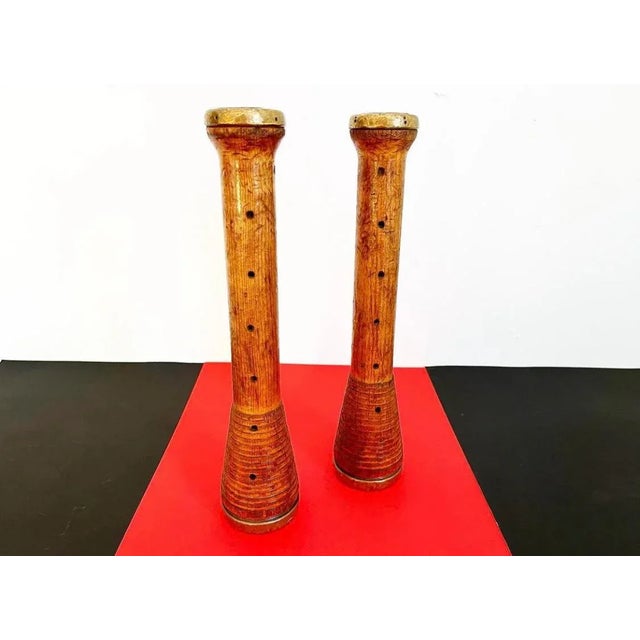 Stunning, tall and sculptural pair of hand carved and pierced wood 1960s Brutalist-style candle sticks in the form of...