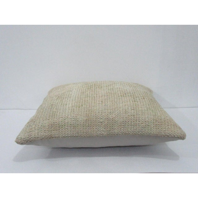 Decorative pillow cover made from a vintage Turkish handknotted rug. Backed with good quality cotton fabric. Pillow...