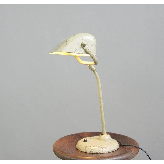 Model 6581 Table Lamp By Kaiser Idell Circa 1930s Adjustable steel shade and arm - Cast steel base - On/Off switch on the...