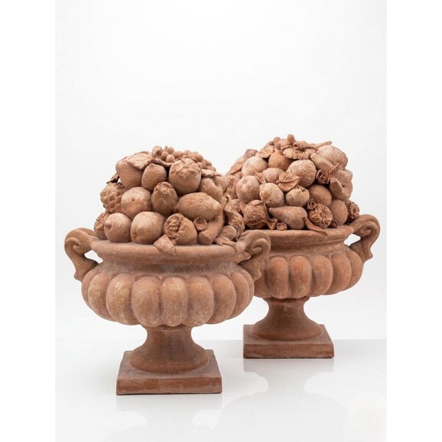 This striking pair of vintage Italian terracotta baskets showcases an abundant arrangement of hand-sculpted fruits,...