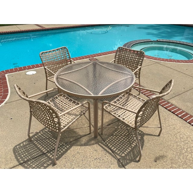 This is a great set of 5, 4 chairs & 1 matching table in sand color