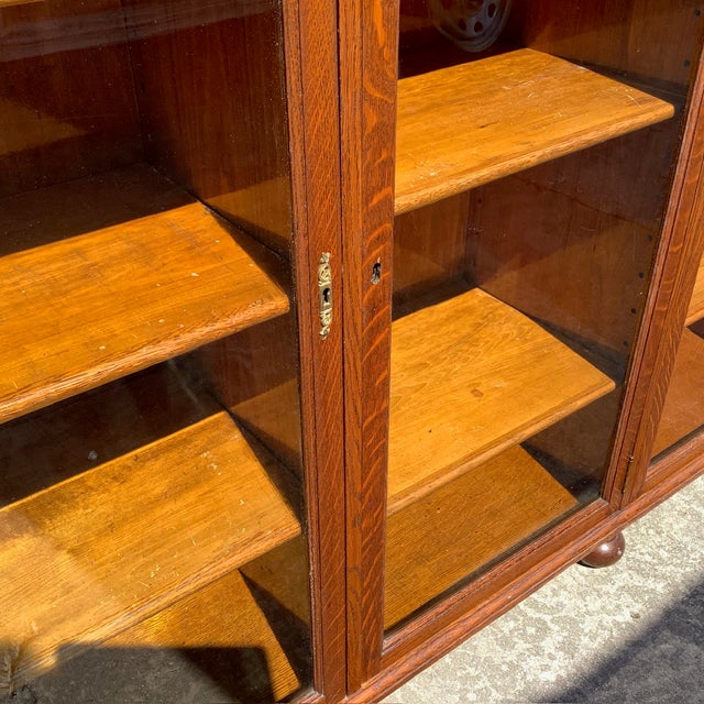 Large Triple Wide Glass Front door Library Case. Original Wavy Glass and all wood Shelves. Excellent condition throughout....
