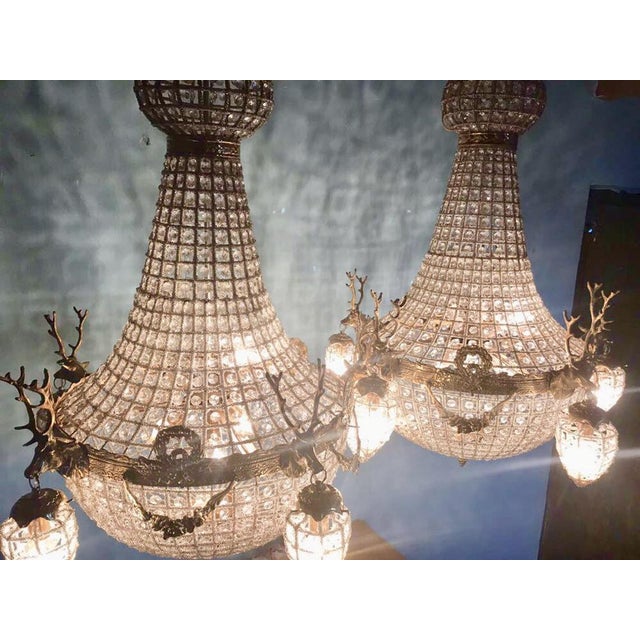 Introduce grandeur and symmetry into your interior with this impressive pair of French Louis XVI-style chandeliers,...