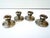 Elegant set of four antique English sterling silver candlesticks with a classic stepped base and understated traditional...