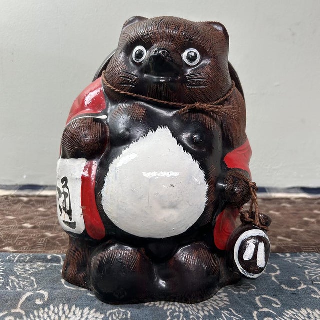 Cheerful Tanuki Statue from Shigaraki, 1970s. This handcrafted statue, made from traditional clay, is a unique eye-...