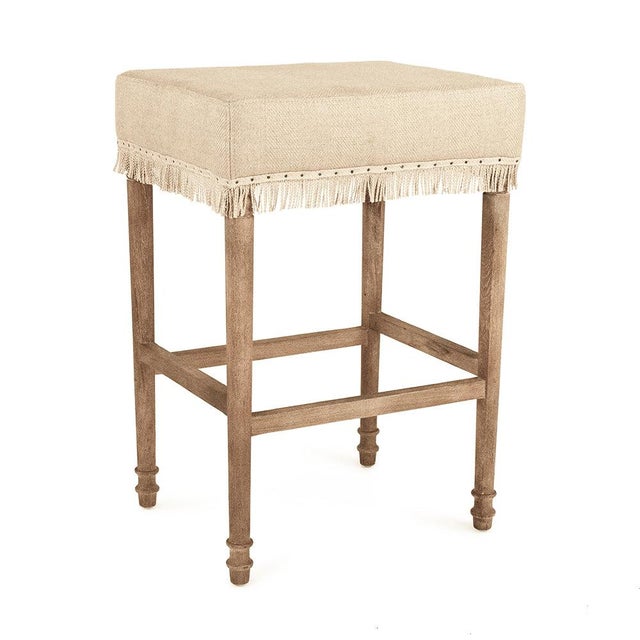 The Lucas Bar Stool from Zentique is a charming French country bar stool with a padded hemp linen seat, playful fringe...