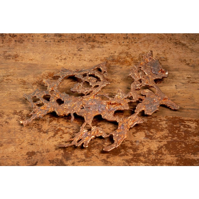 This folk art piece is made of melted copper. This piece measures 12"x9.25". JM - 080822 - 104779