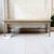 A late 18th century French farm table with a long plank top, a deep apron, and square legs tapering to the floor in the...