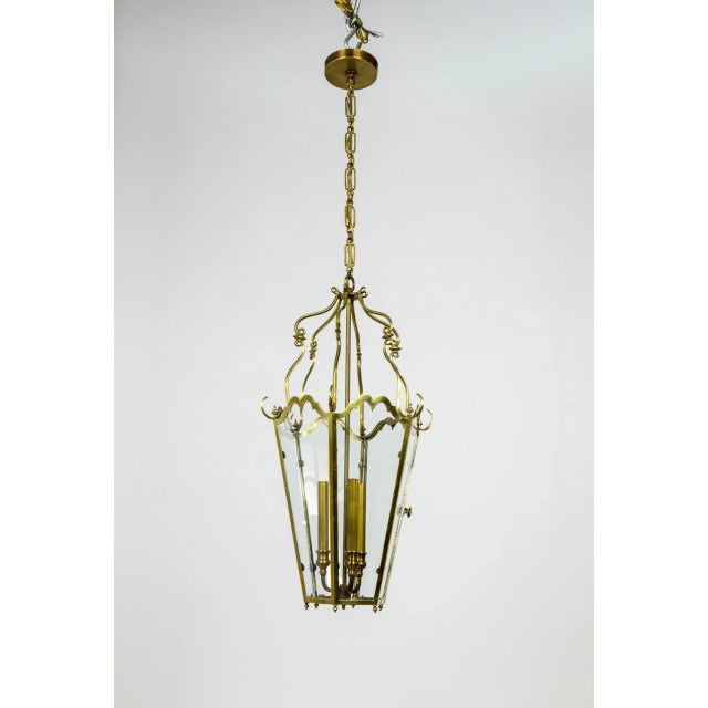 An elegantly decorative six panel, 3-light glass and brass lantern. French origin - Belle Epoque style. Each glass panel...