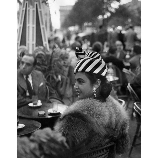 Crowning Glory An elegant Parisian spends the morning in a Champs Elysees cafe. Original Publication: Picture Post - 5343...
