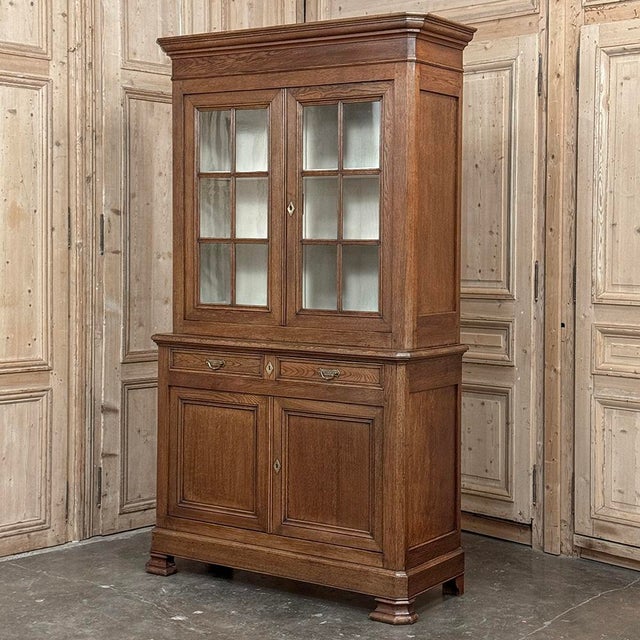 19th Century French Louis Philippe Period Bookcase ~ Bibliotheque is a stately example of the genre, rendered from dense,...